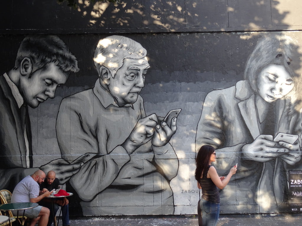 Mural of people on their phone, reduce screen time